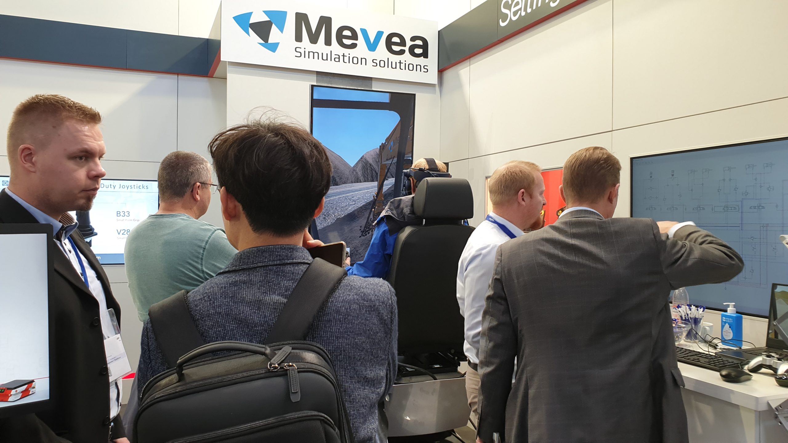 Visitors at Mevea stand in Bauma 2022 fair.