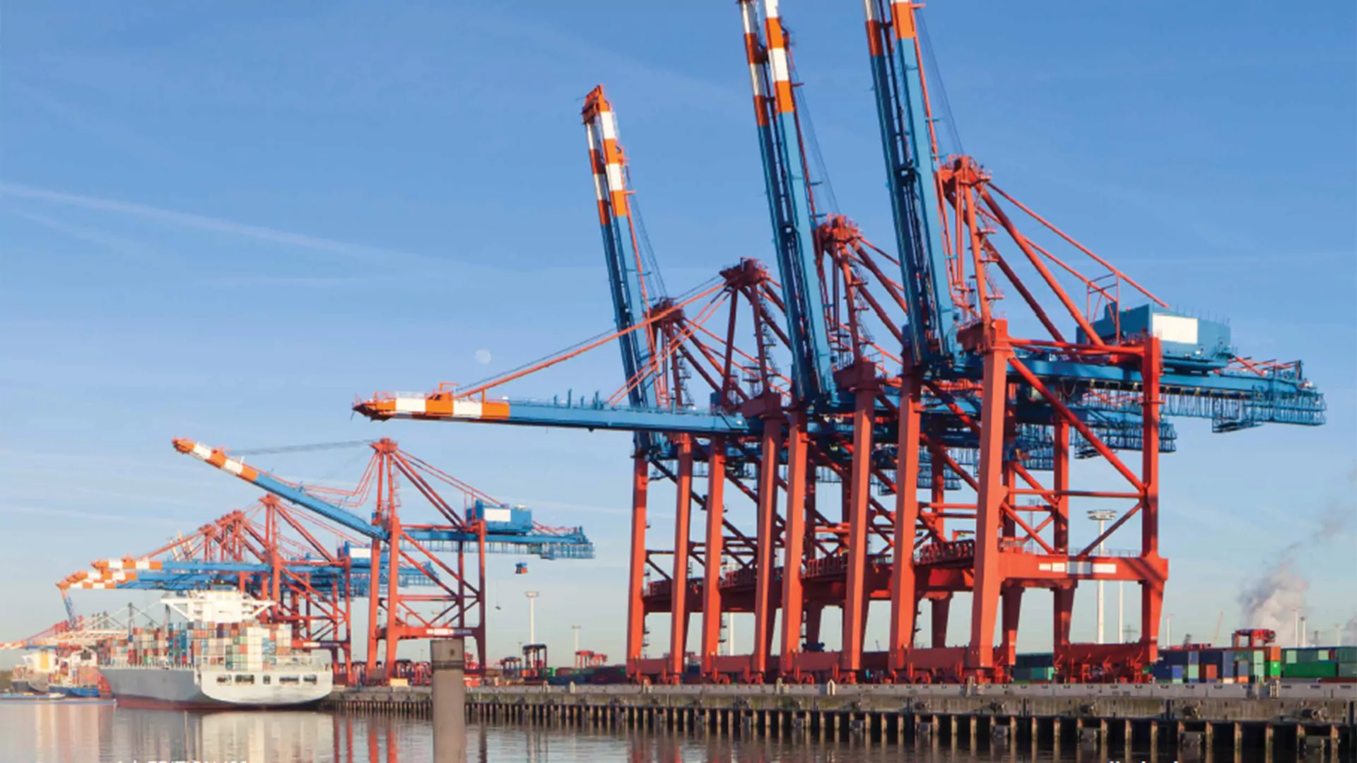 Ship-To-Shore cranes at some container terminal.