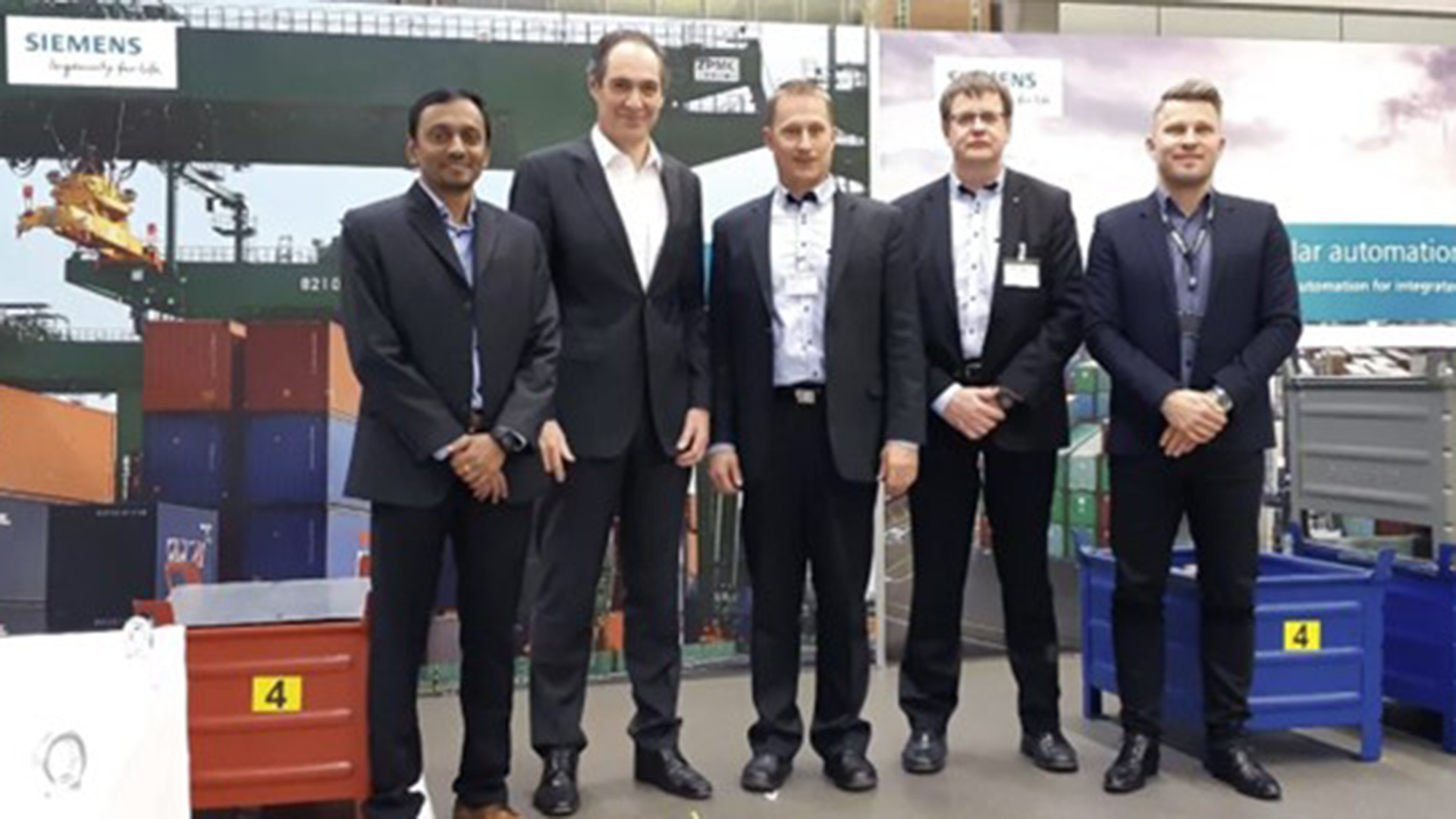 From left to right: Mahadevan Balasubramaniam (Siemens), Dr. Christian Koegl (Senior Vice President of Siemens AG, CEO of Siemens Cranes), Tero Eskola (Mevea), Raimo Nikkila (Mevea), Benjamin Jeffries (Siemens).